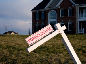 Modern house with foreclosure sign